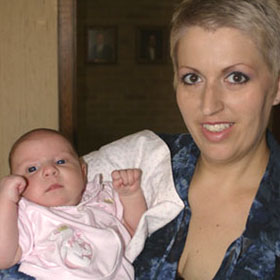 Heather poses with her infant daughter.