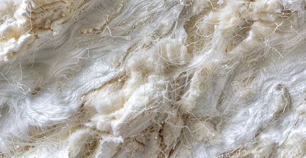 fluffy, fibrous asbestos insulation