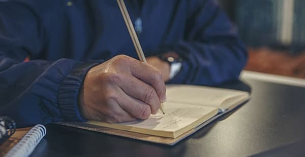 Mesothelioma patient signing end-of-life planning documents