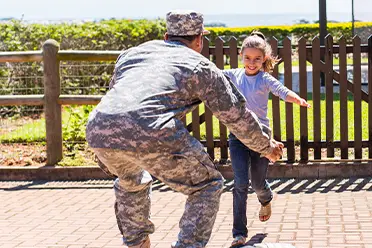 Photo of veteran hugging daughter