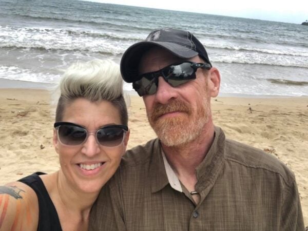 Heather Von St. James and her husband, Cameron, on the beach.