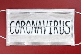 White mask with coronavirus label