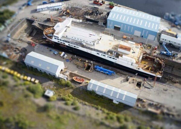 Ship docked on land at a shipyard similar to ones like Key Highway Shipyard, where asbestos was used