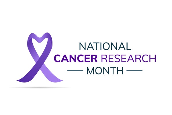 Text on a white background reading "National Cancer Research Month" with a purple ribbon in a heart-shape.
