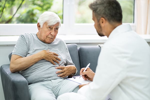 A mesothelioma patient talks to their oncologist about treatment side effects that are making it difficult to eat.