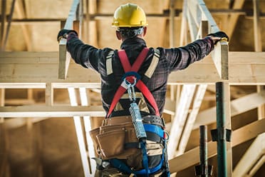 Photo of carpenter building a roof