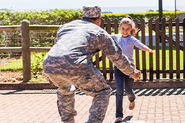 Photo of veteran hugging daughter