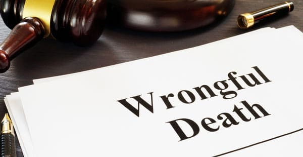 Gavel lying above a document labeled “Wrongful Death”